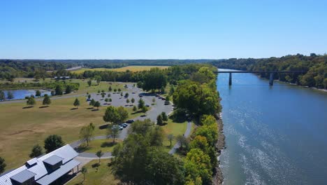 Orbit-drone-shot-of-a-fishing-pond-area-in-Clarksville,-Tennesse