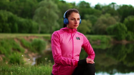 the girl warms up early in the morning before training preparing for a run in the sun