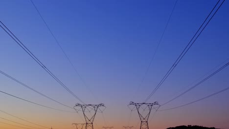 Electricity-pylons-during-sunset-4k