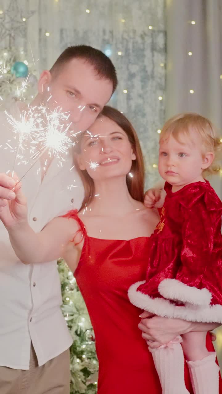 A joyful holiday celebration captured in two frames, where a woman in a stunning red dress shares a magical moment with her partner and child, surrounded by festive decorations and sparkling lights