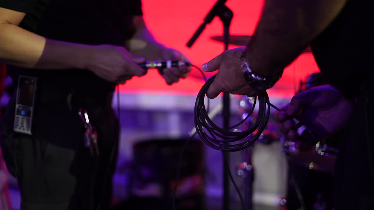 Two men connected the sound system
