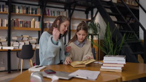 teenagers studying together in a library