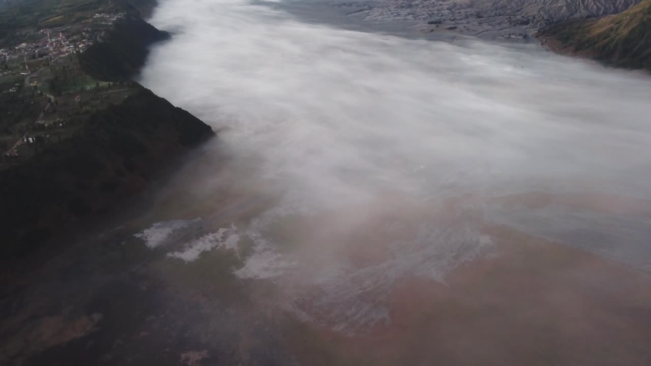 Beautiful view of Mount Bromo National Park in the morning with thin mist covering the area.