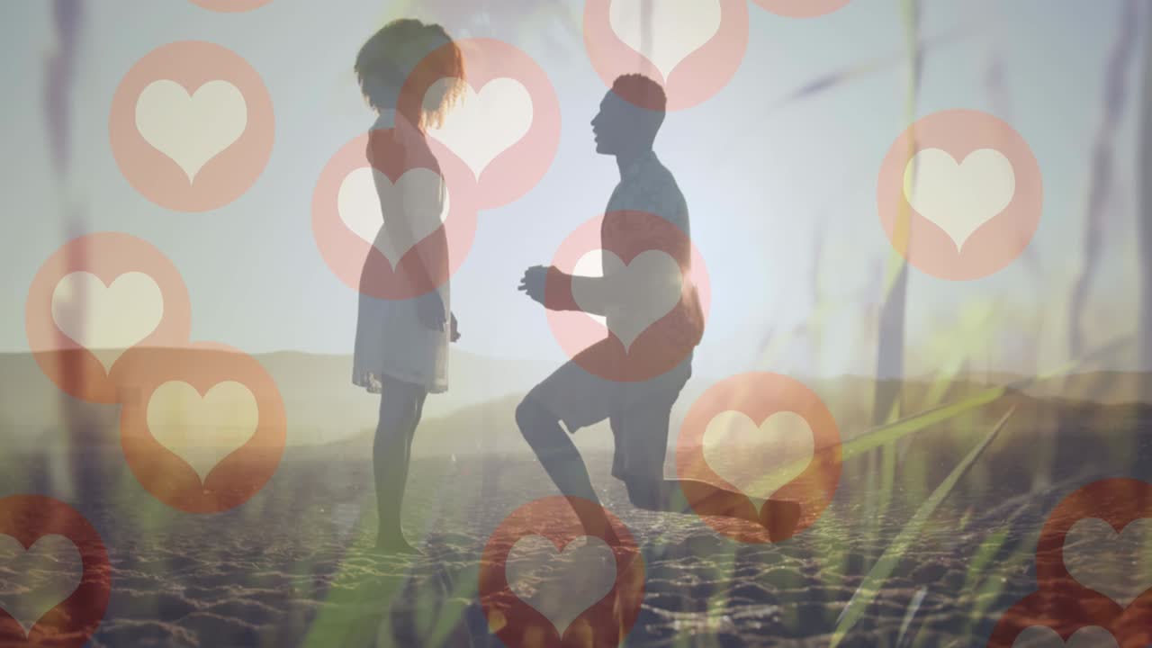 커플 위에 떨어지는 심장 아이콘의 애니메이션