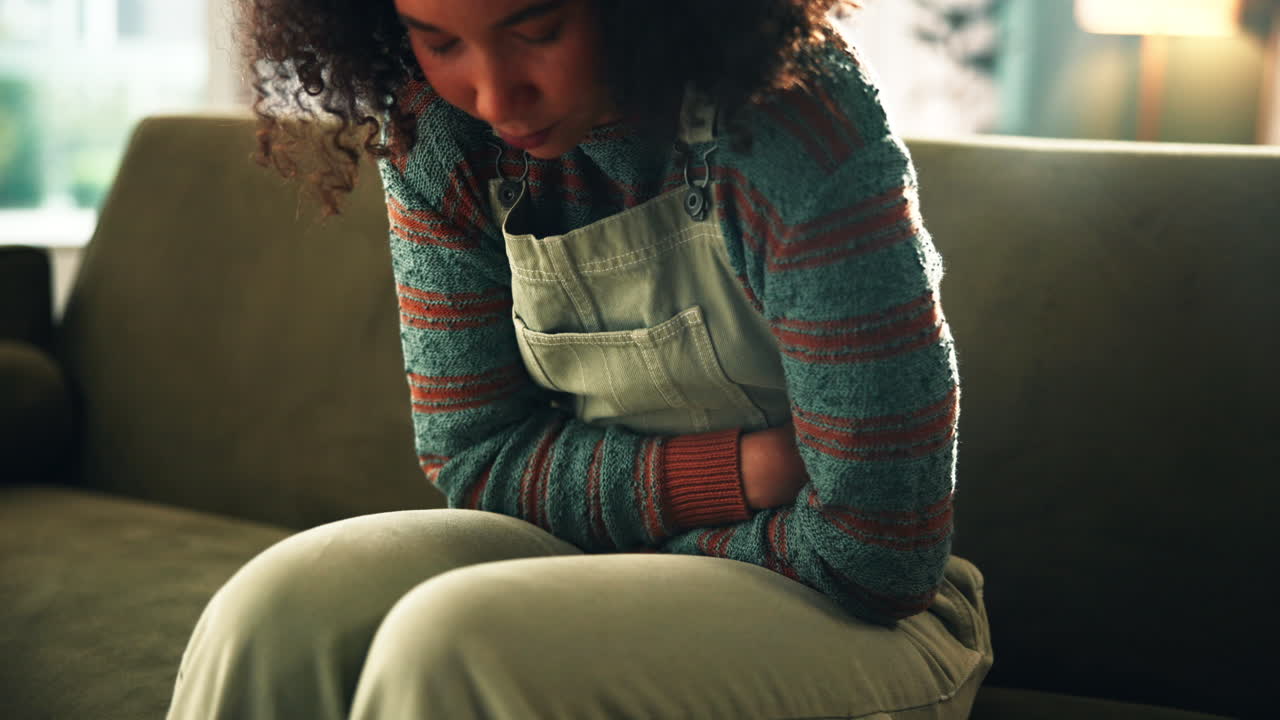 Woman holding her stomach in pain