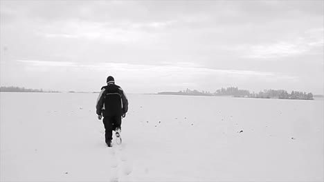 walking-through-snow-on-a-winter's-day-with-people-stock-footage-stock-video