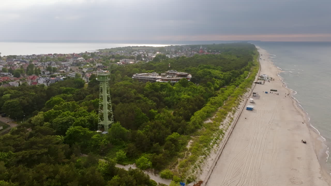 Aerial view of a beach with a watchtower in Jastarnia, sunset in Hel, Poland