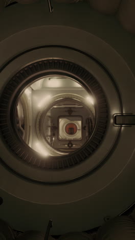 a view of the interior of a spaceship through a round window