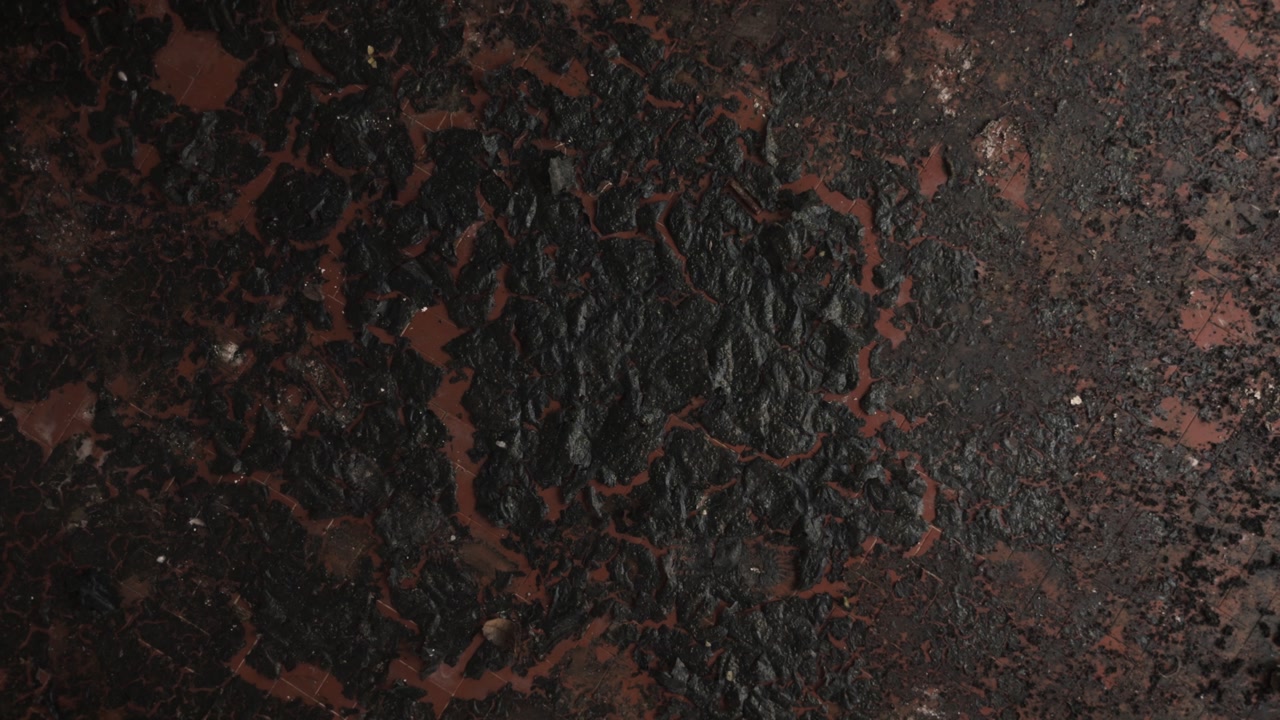Cinematic aerial drone footage gliding through an abandoned factory interior