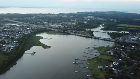 Tilt-Down-Aerial-View-on-Kent-Island,-Maryland-USA-in-Twilight,-Skyline-and-Interstate-Highway-Over-Chesapeake-Bay