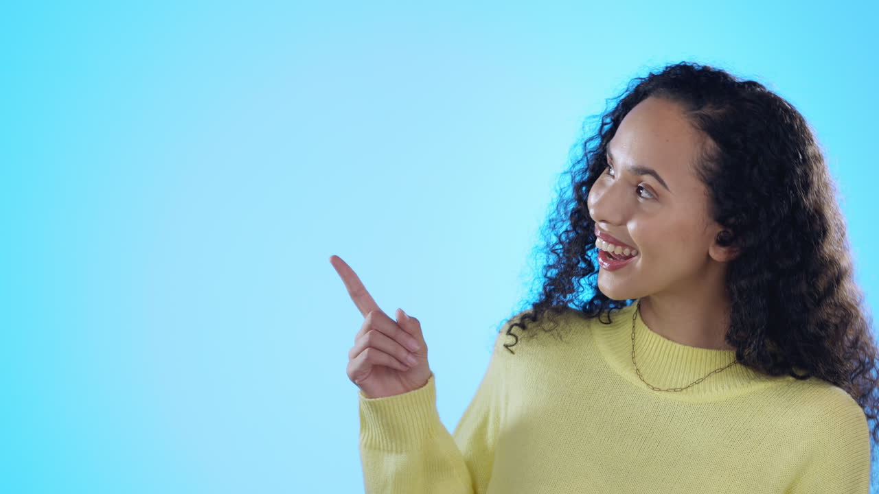 Woman face, smile and hand pointing in studio