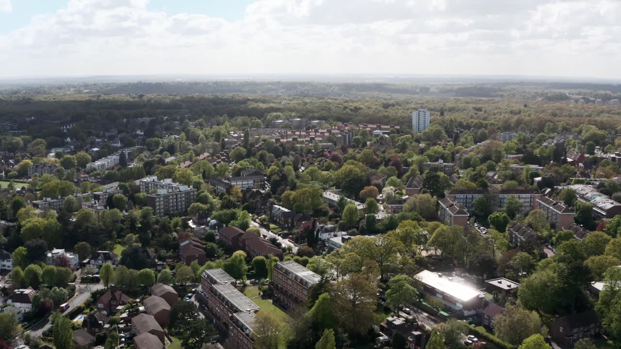 Drone shot of houses in Wimbledon London surrounded by trees