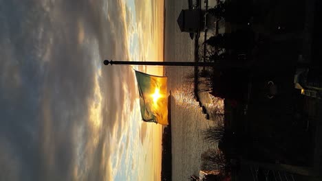 ukraine flag in slow motion during a sunrise on a flag pole, vertical video