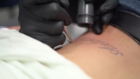 woman remove tattoo, deleting or erasing