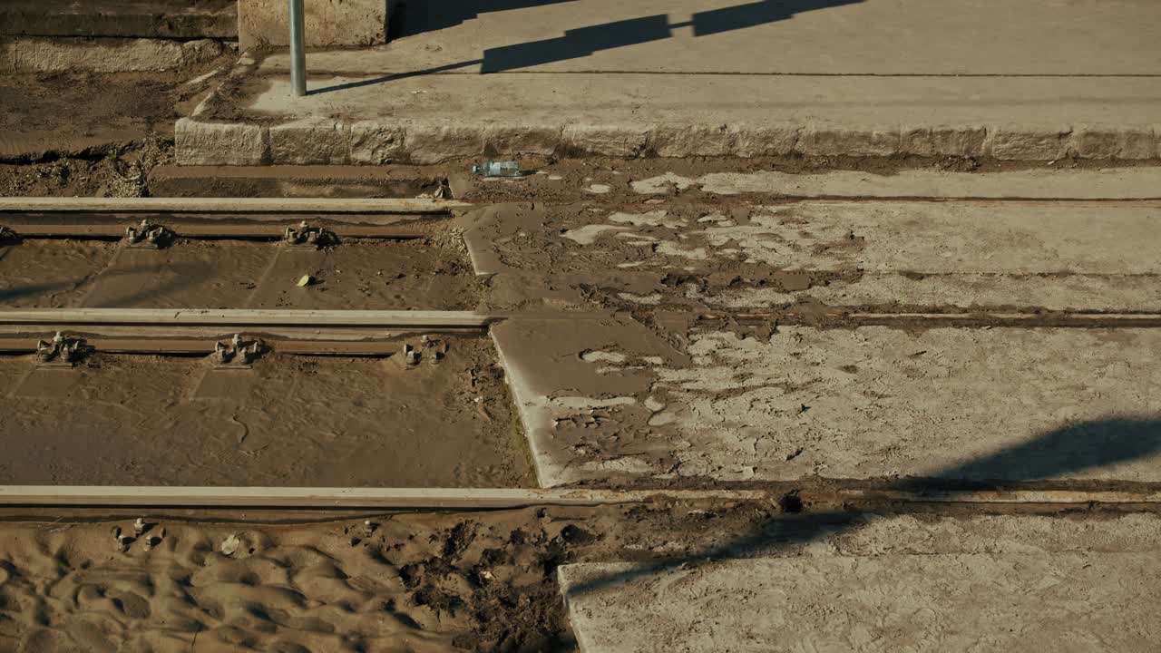 Mud covered tram tracks exposed after flooding during the Budapest Flood of 2024