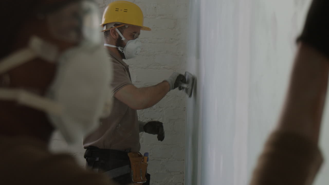 Construction Worker Plastering a Wall