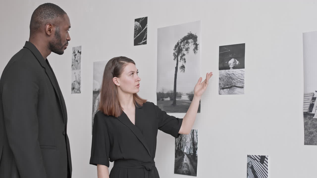 Colleagues Discussing New Photography Exhibition