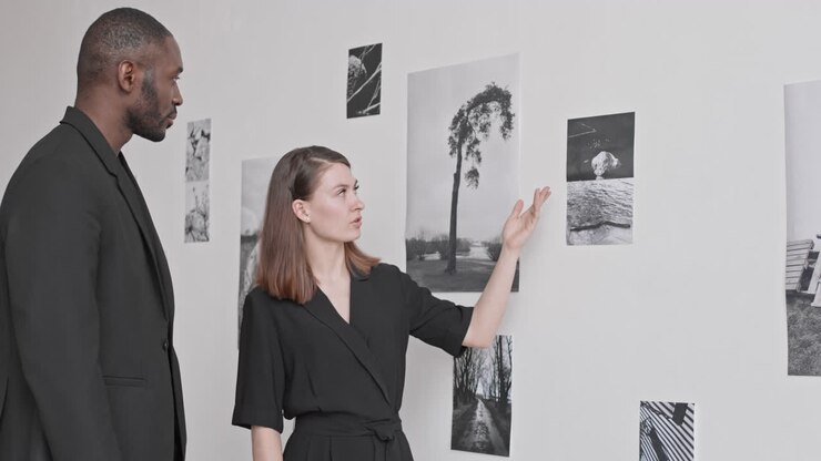 Colleagues Discussing New Photography Exhibition