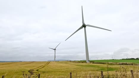 wind turbines spinning in dunkeld, scotland landscape