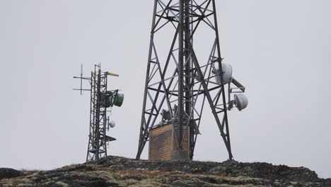 5g antenna towers in the stark northern landscape against the grey sky