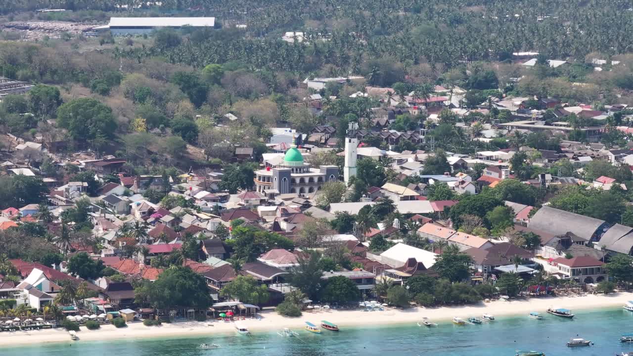 Mosque in small settlement in tropical island with sandy beachfront. Gili Trawangan, Indonesia.