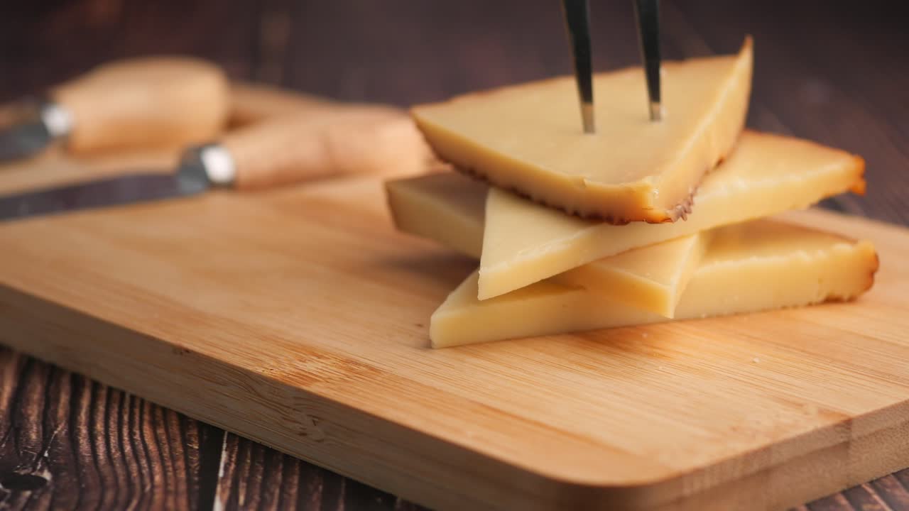 Cheese slices on a cutting board