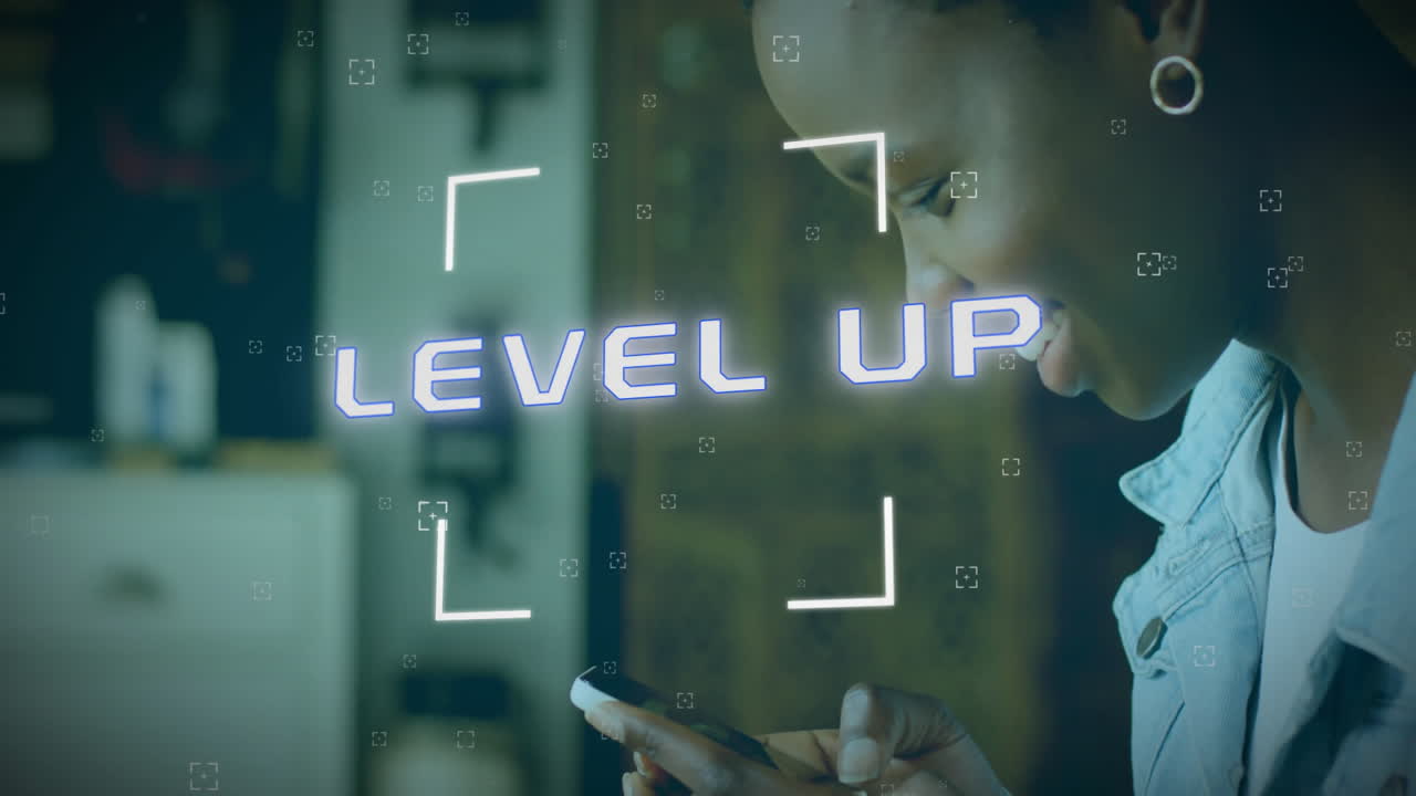 Animation of level up text over african american woman using smartphone