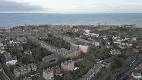 aerial upwards of saint andrews, town and saint andrews cathedral in background