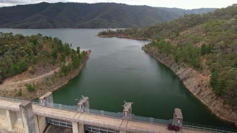 over lake eildon and revealing the road over the dam and the spillway below