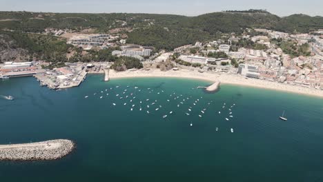 Boats-moored-in-blue-sea-of-Sesimbra-in-Portugal