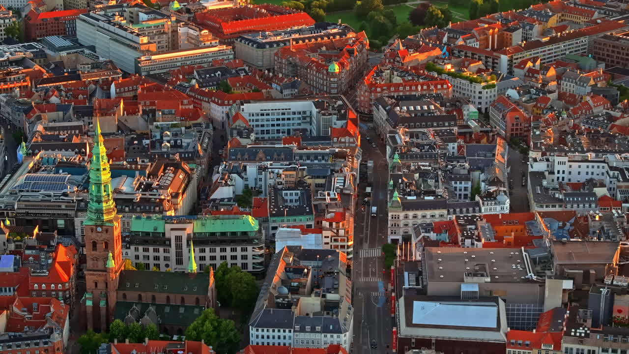 Aerial drone view of the city centre of Copenhagen, Denmark at sunset
