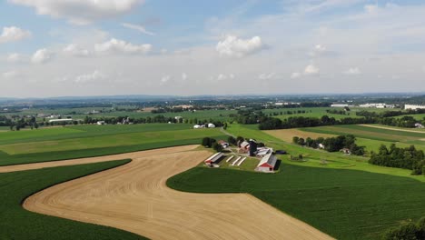 Drone-shot-of-curve-road-and-agricultural-land