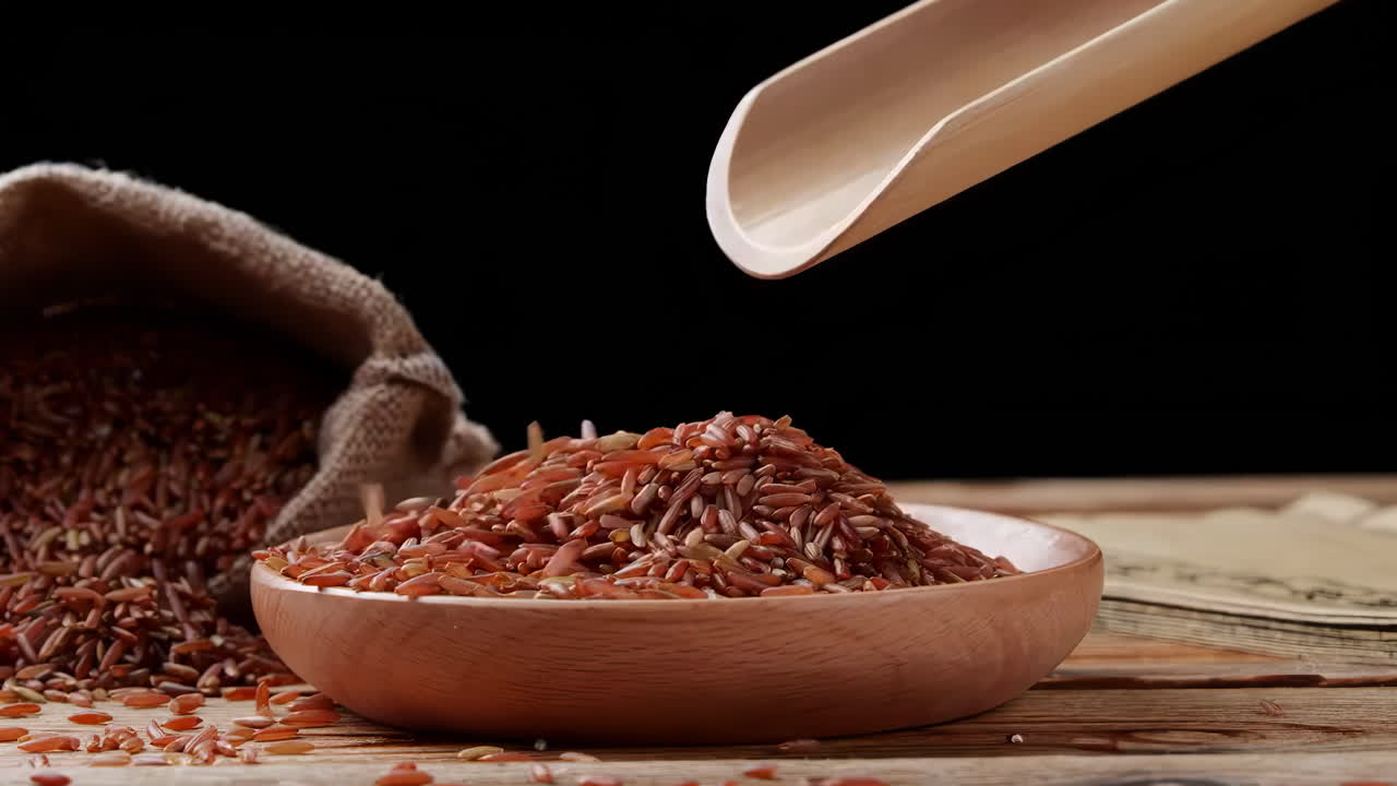 A variety of different colored Raw healthy grain food, Various grains, cereals, beans, legumes are rotated in wooden decoration for advertisement concept