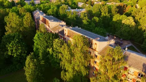 drone, rooftop windows of classic soviet housing block on a quiet riga morning
