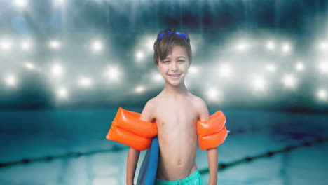 animation of smiling caucasian boy in swimming trunks over swimming pool