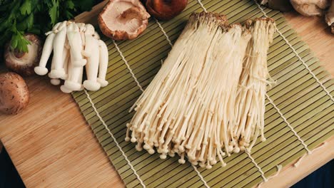various mushrooms on a wooden cutting board