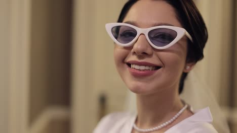 beautiful bride wearing cat eye sunglasses