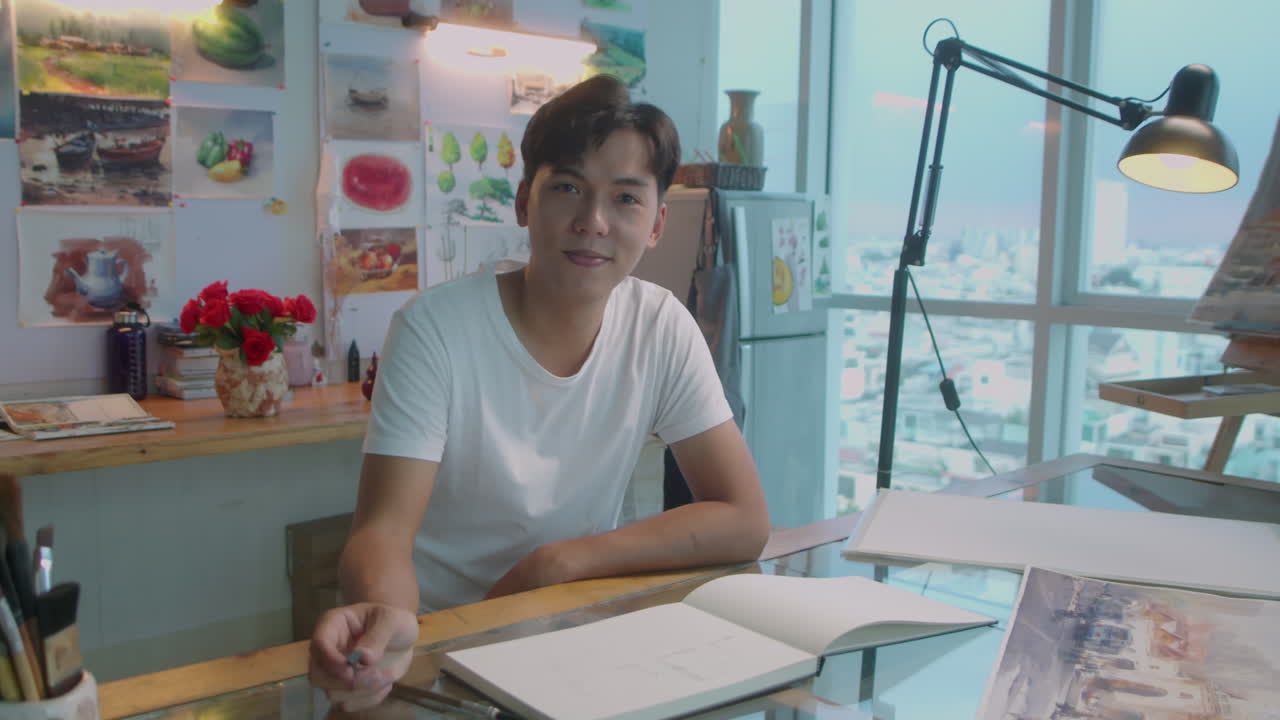 Portrait of Cheerful Asian Artist in Studio