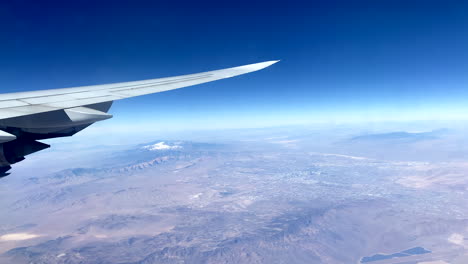 Plane-flight-above-Nevada---visible-Las-Vegas-from-plane-window