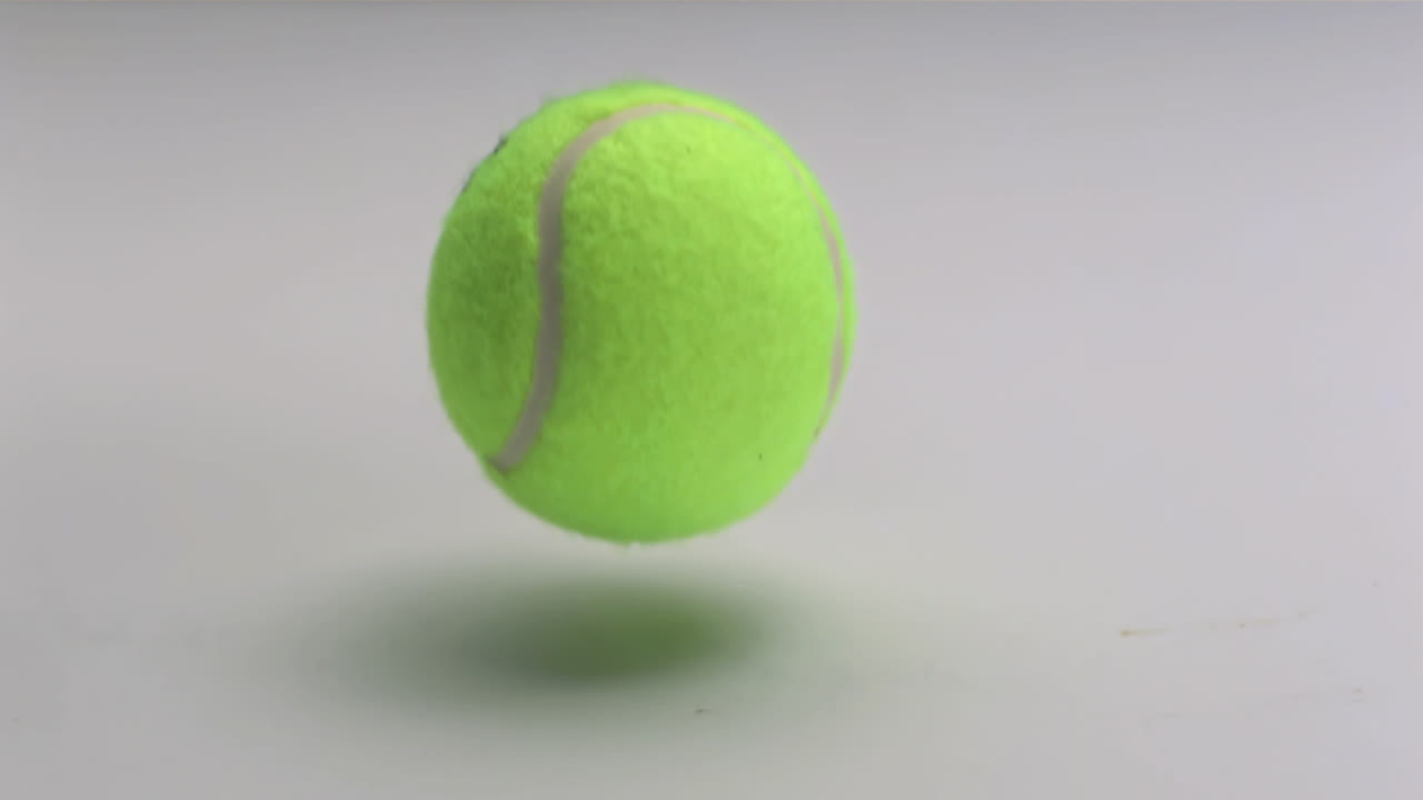 Tennis ball dropping and bouncing
