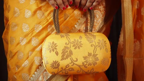 yellow clutch with floral embroidery