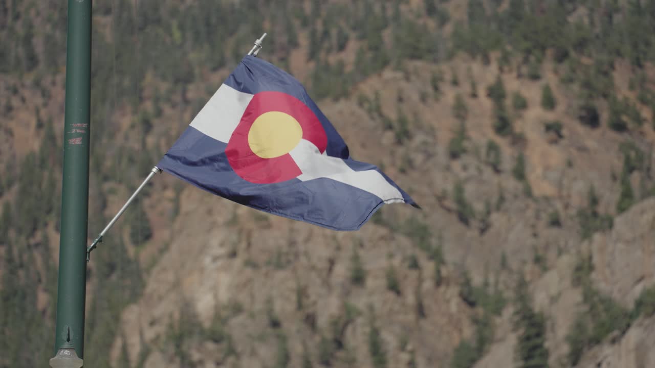 Colorado Flag with Mountain Background