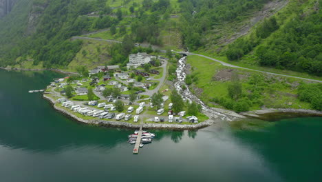 a trailer park in norway on a side of geiranger fjord