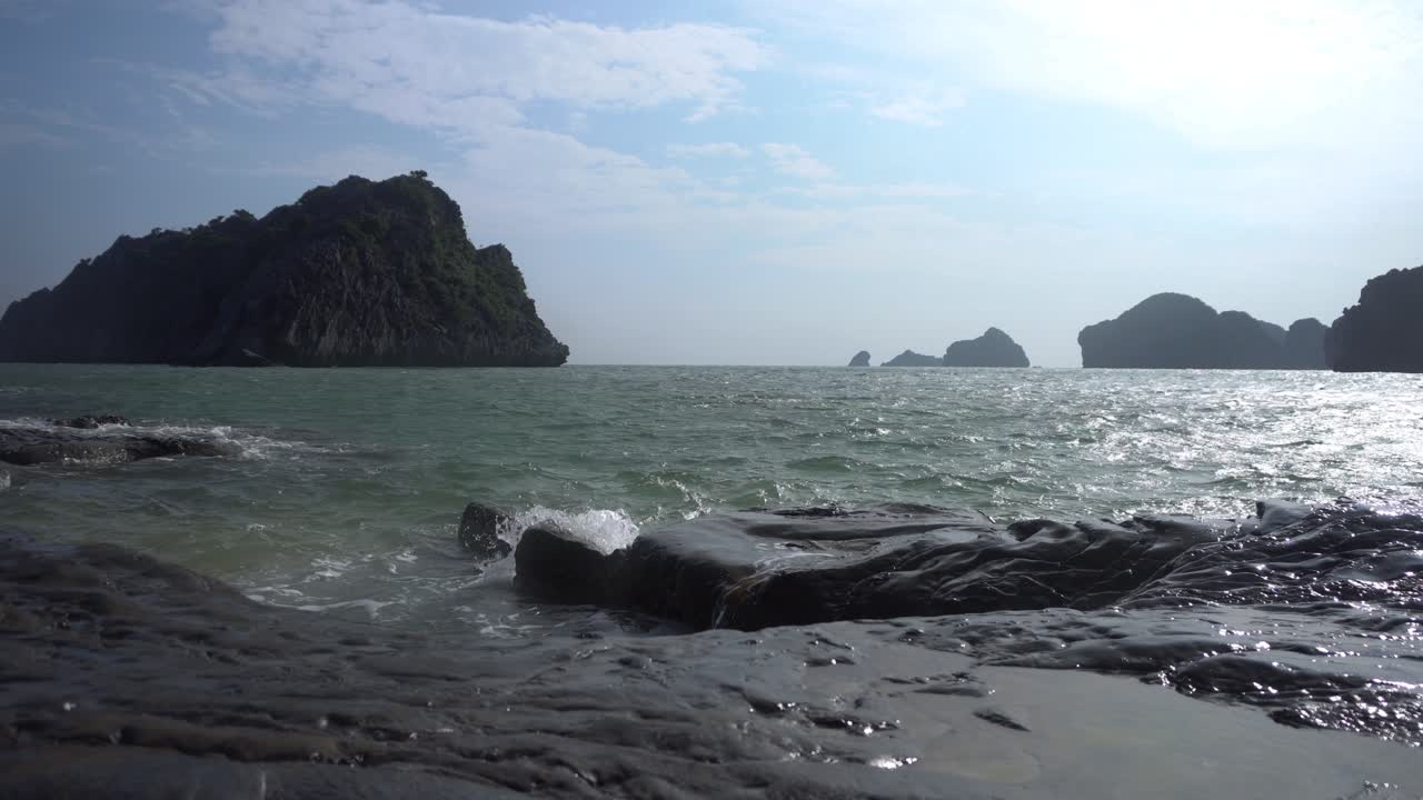 Beautiful day on the beach in Asia, waving ocean