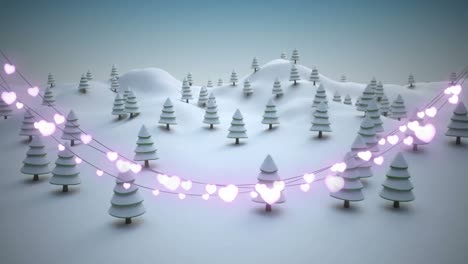 glowing heart shaped fairy lights decoration against snow falling over winter landscape