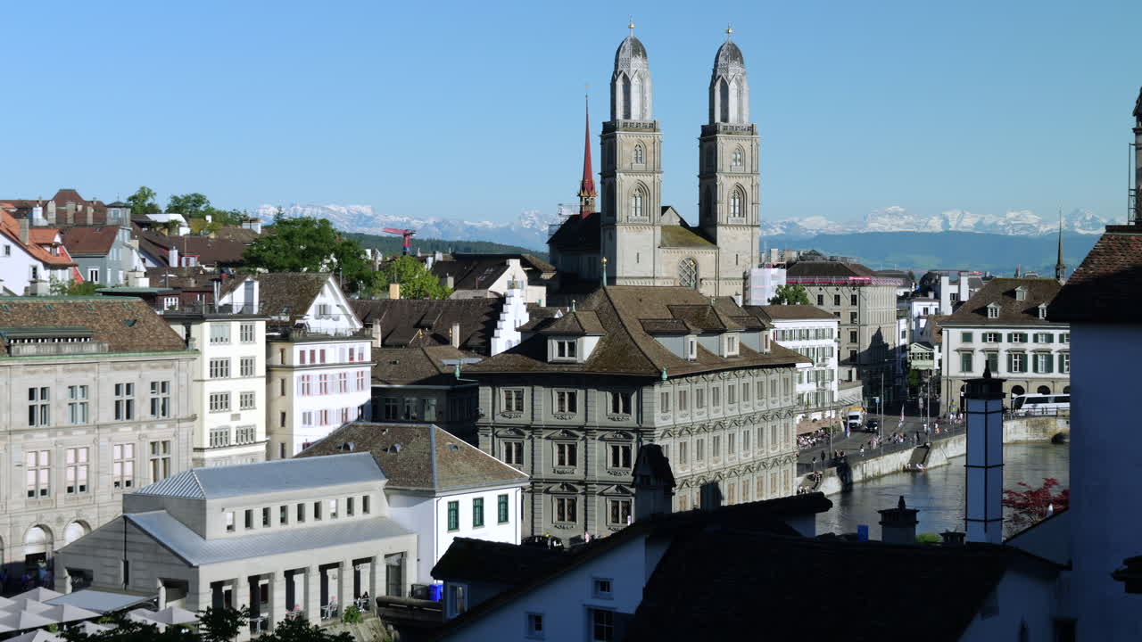 Imposing Architecture With Two Towers Of The Grossmunster Cathedral In Zurich, Switzerland. Aerial Shot
