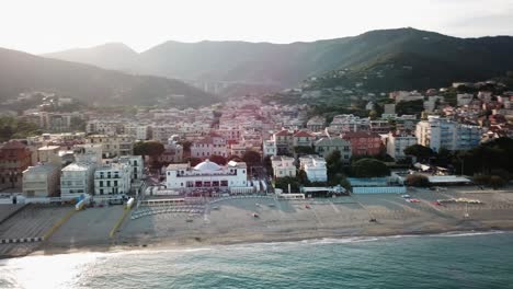 aerial drone shot of a village next to the mediterranean sea, genoa, italy