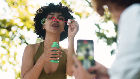 Woman-blowing-bubbles-outdoors