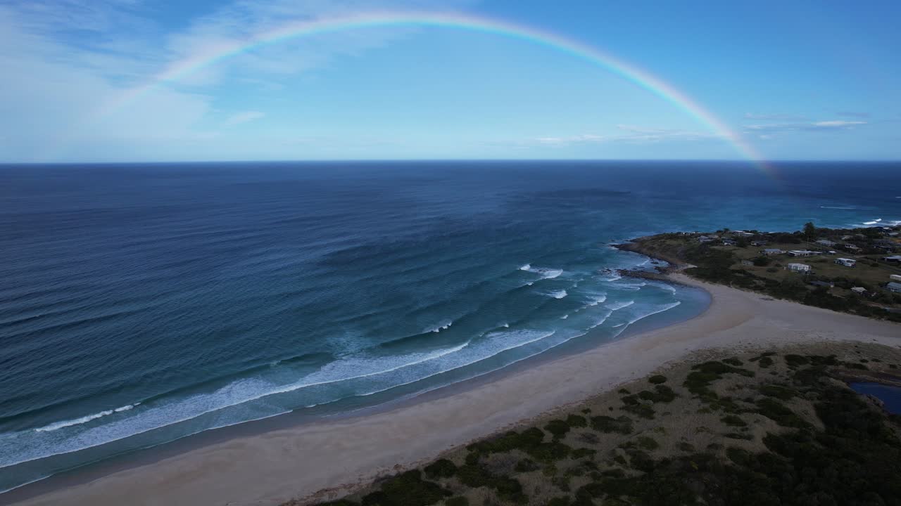 Steels Beach With Rainbow Over The Ocean In Tasmania, Australia - Drone Shot
