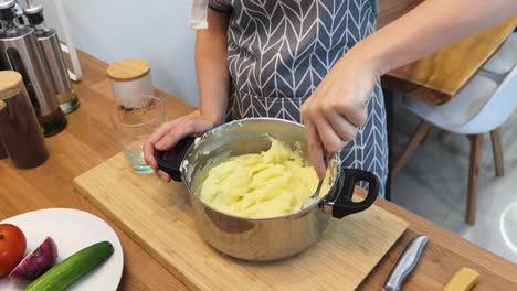 woman making mashed potatoes